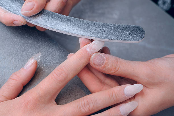 Polishing fingernails stock photo