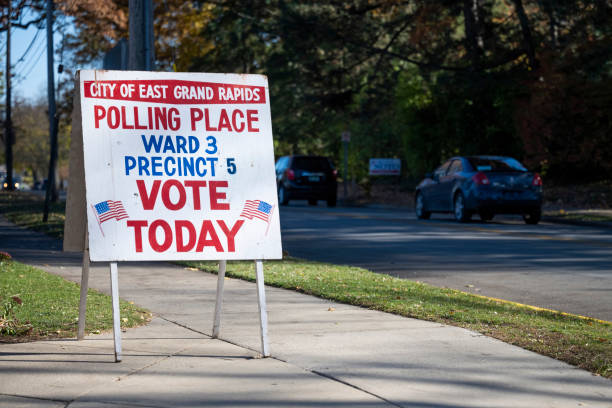 Polling Place East Grand Rapids, Michigan: A sign outside a polling station on November 3, 2020. donald trump stock pictures, royalty-free photos & images