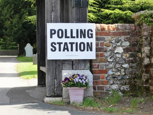 UK polling station sign at church premises This photo was taken in Chorleywood, Hertfordshire, England, UK polling place stock pictures, royalty-free photos & images