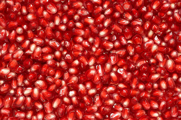 Pomegranate seeds background stock photo