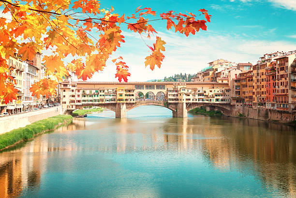 Ponte Vecchio, Florence, Italy famous bridge Ponte Vecchio over river Arno at fall day, Florence, Italy, retro toned arno river stock pictures, royalty-free photos & images