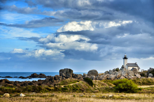 Pontusval, Brittany, the little lighthouse Phare de Pontusval, small lighthouse in the rocks on the beach at Brignogan-Plage, Brittany, France finistere stock pictures, royalty-free photos & images