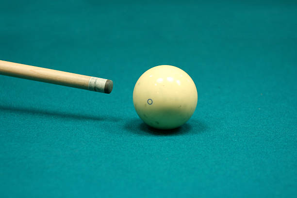 Pool stick and cue ball stock photo