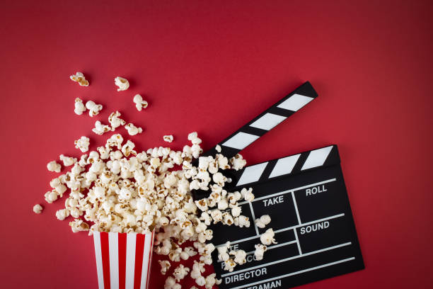 popcorn and clapperboard popcorn, red, background, clapperboard clapboard stock pictures, royalty-free photos & images