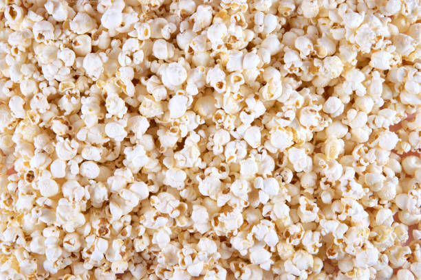 Popcorn Background Fresh popcorn background popcorn stock pictures, royalty-free photos & images