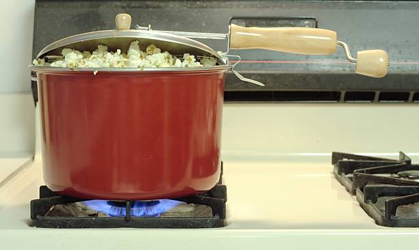 Popcorn on the stove stock photo