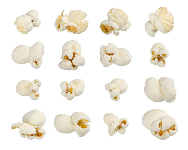 Popcorn set on white Scattered popcorn isolated on white background. Close up shot. High quality image. astfood popular during a movie in a cinema. Desogn element for advertisement, flyer, poster. popcorn stock pictures, royalty-free photos & images