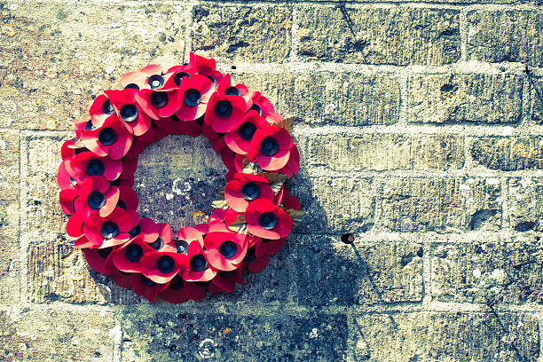 Poppy Wreath on a Cotswold Stone Wall. 