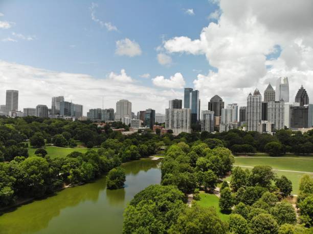 A popular Piedmont park in Atlanta shot by a drone with a view of Atlanta skyline, Lake and park stock photo