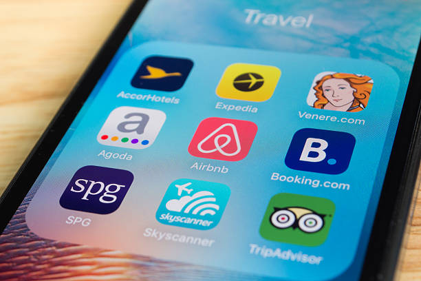 Popular Travel Applications Bangkok, Thailand - June 6, 2016 : Apple iPhone5s showing its screen with popular travel applications. airbnb stock pictures, royalty-free photos & images