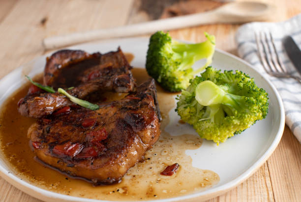 pork chops with brown sugar, garlic sauce - pork pine bildbanksfoton och bilder