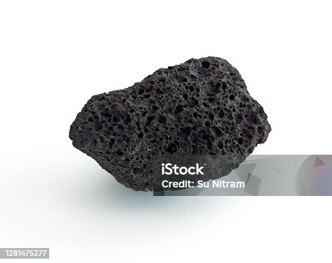 istock Porous black volcanic rock isolated on white background. Lava stone, pumice stone, or volcanic pumice with distinctive pores, isolated on white. Close up. 1281475277