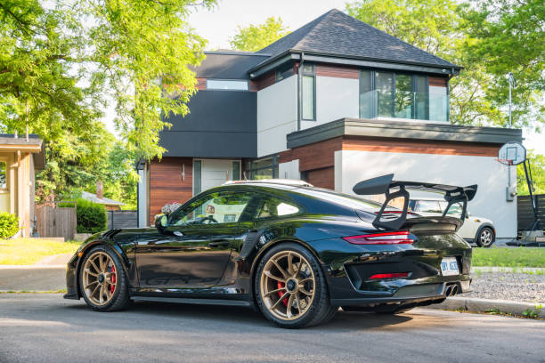 Porsche 911 GT3 RS A black colored Porsche 911 GT3 RS (991.2) luxury sports car is parked on a street in Toronto, Ontario, Canada on a sunny day. porsche 911 stock pictures, royalty-free photos & images