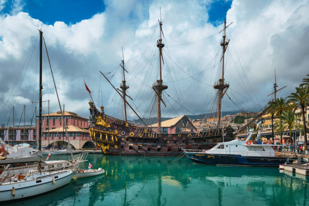 porto di genova, italia con replica navale di un galeone spagnolo del xvii secolo - genova foto e immagini stock