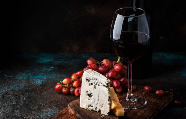 Port wine and blue cheese, still life in rustic style, vintage wooden table background, selective focus Port wine and blue cheese, still life in rustic style, vintage wooden table background, selective focus semi sweet chocolate stock pictures, royalty-free photos & images