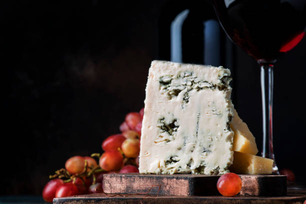 Port wine and blue cheese, still life in rustic style, vintage wooden table background, selective focus Port wine and blue cheese, still life in rustic style, vintage wooden table background, selective focus semi sweet chocolate stock pictures, royalty-free photos & images