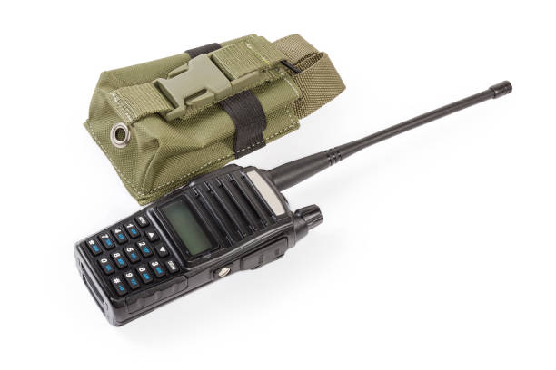 Portable handheld FM transceiver and soft case on white background Modern amateur portable handheld transceiver, so-called walkie-talkie or two-way radio and his textile soft case on a white background public service stock pictures, royalty-free photos & images