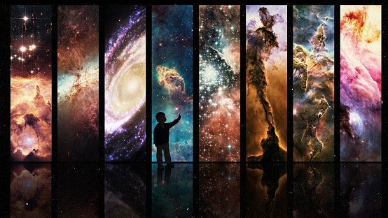 Silhouette of a child looking at a display of varying galactic phenomena- ALL design on this image is created from scratch by Yuri Arcurs'  team of professionals for this particular photo shoothttp://195.154.178.81/DATA/i_collage/pi/shoots/783653.jpg