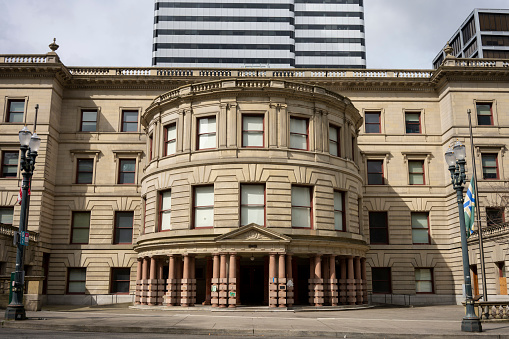 Portland, OR, USA - Mar 21, 2021: The Forth Ave main entrance of Portland City Hall, a 4-story Renaissance-style building that houses the offices of the city council, during the longstanding protests.