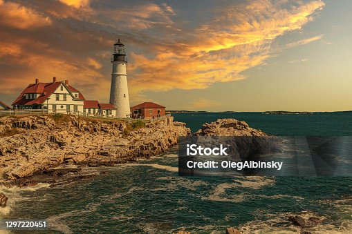 istock Portland Head Light with Rocky Cliffs, Ocean Surf and Beautiful Sunset Sky. 1297220451