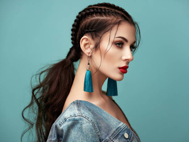 Portrait beautiful woman with jewelry Brunette girl with perfect makeup. Beautiful model woman with curly hairstyle. Care and beauty hair products. Lady with braided hair. Model with jewelry. Turquoise background braided hair photos stock pictures, royalty-free photos & images