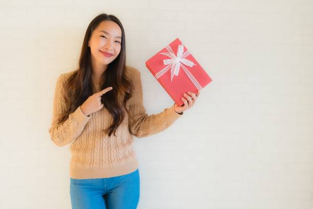 Portrait beautiful young asian women happy smile with gift box stock photo