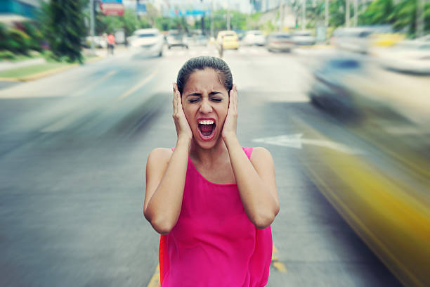 Portrait business woman screaming at street car traffic stock photo