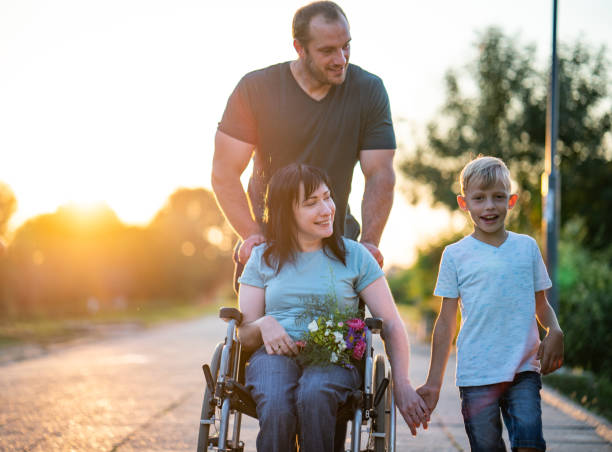 Portrait happy family with disability mother stock photo