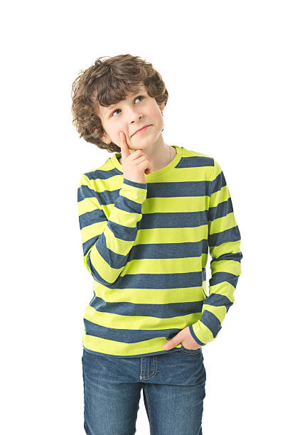 portrait of 8 years old boy thinking stock photo