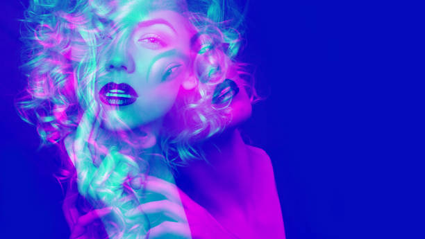 Portrait of a attractive woman with blonde curly hair. Double color exposure. stock photo
