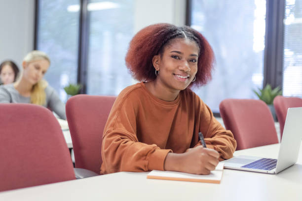 Portrait of a beautiful black female university student stock photo