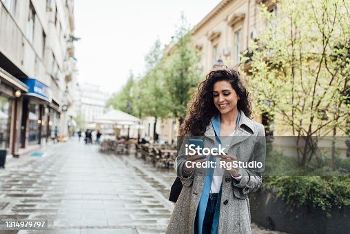 istock Portrait of a beautiful businesswoman banking online on the move 1314979797