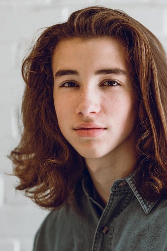Portrait Of A Beautiful Teenage Boy With Long Hair High