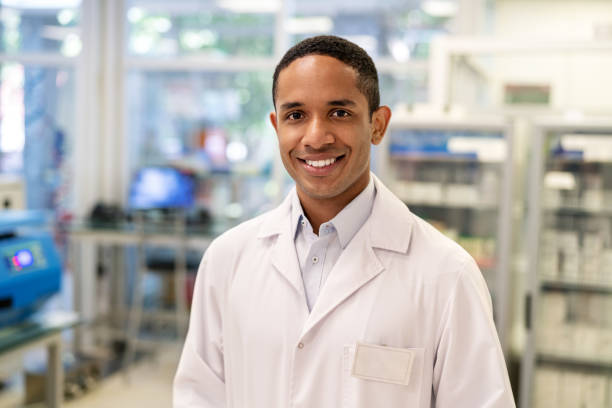 Portrait of a confident male scientist standing in a medical laboratory stock photo