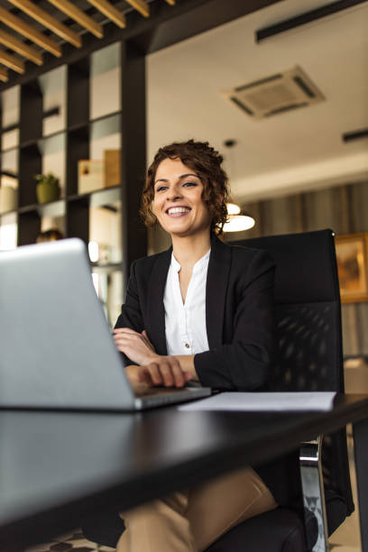 Portrait of a happy businesswoman having online meeting. stock photo