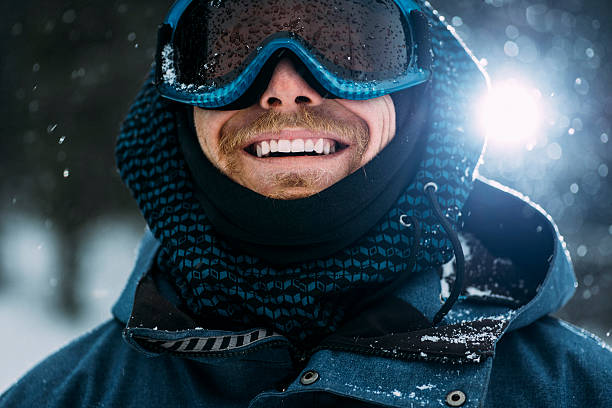 portrait of a happy snowboarder - snowboard imagens e fotografias de stock