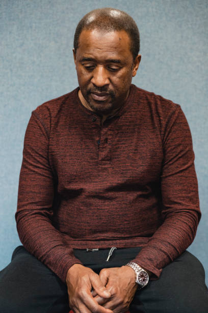 Portrait of a Man Looking Anxious Studio shot of a mature black man looking anxious. sad old black man stock pictures, royalty-free photos & images