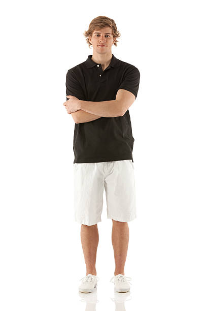 Portrait of a man standing with his arms crossed stock photo