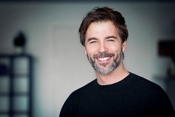 Portrait of a mature man smiling at the camera stock photo