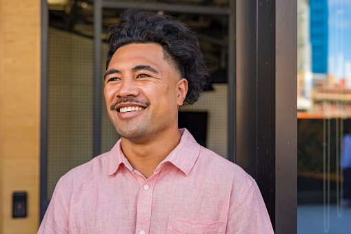 Portrait of a New Zealand Maori man wearing casual business clothes