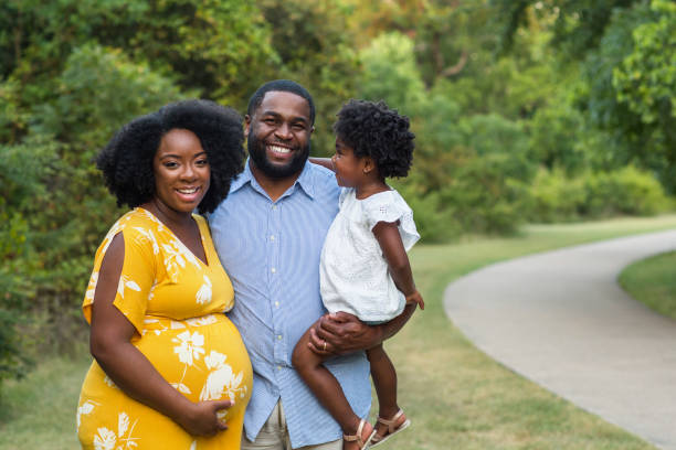 Portrait of a pregnant African American family. stock photo