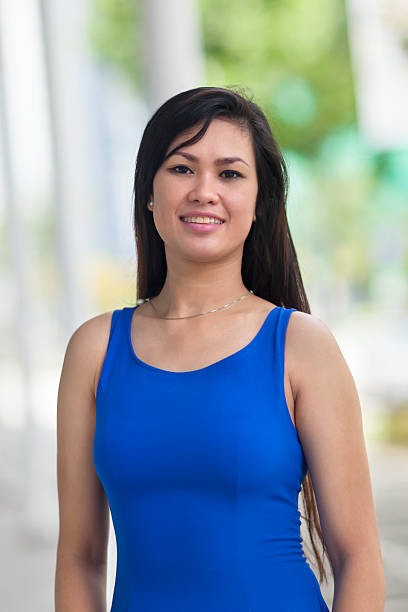 Portrait of a sporty woman outdoors Portrait of a sporty 30+ woman outdoors. filipino woman stock pictures, royalty-free photos & images