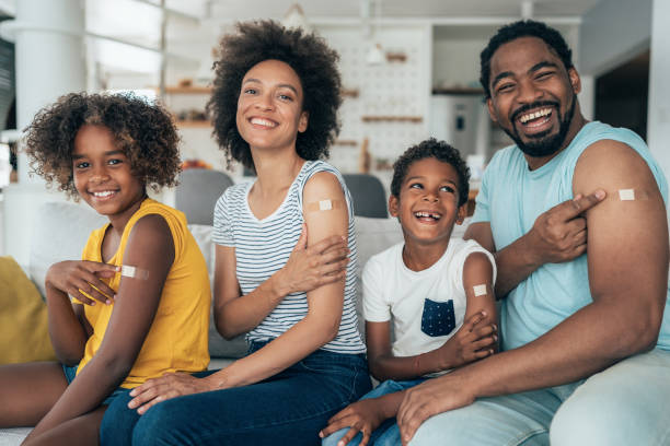Portrait of a vaccinated family stock photo