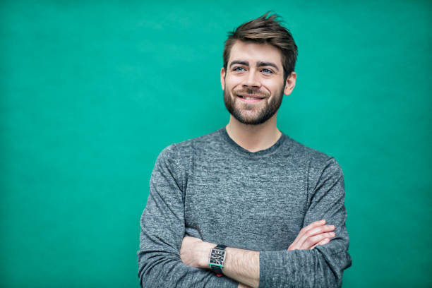 Portrait of a young french man Portrait of a young french man on a green background. french culture photos stock pictures, royalty-free photos & images