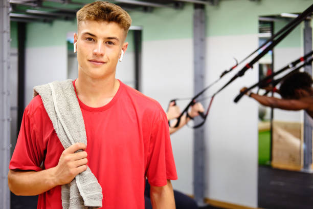 Portrait of a young man at the gym. stock photo