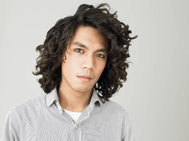 Portrait of a young man  men curly hair stock pictures, royalty-free photos & images