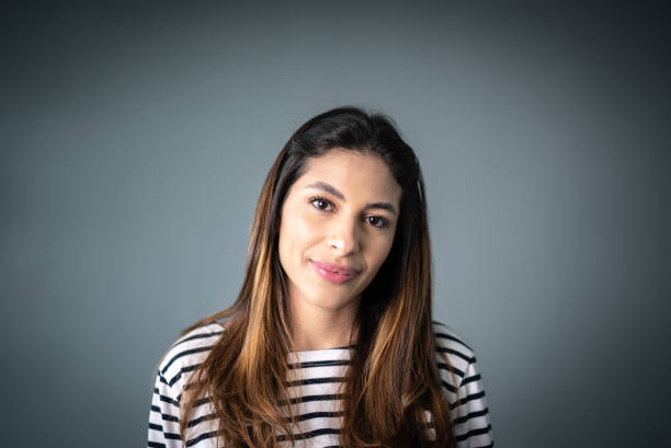 Portrait of a young woman looking at camera stock photo