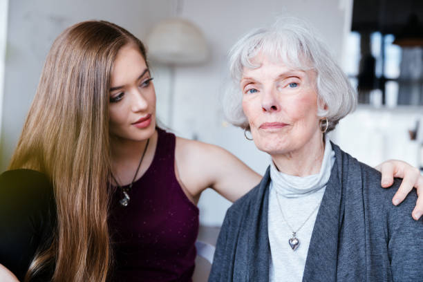 Portrait of a Young Woman with her Grandmother stock photo