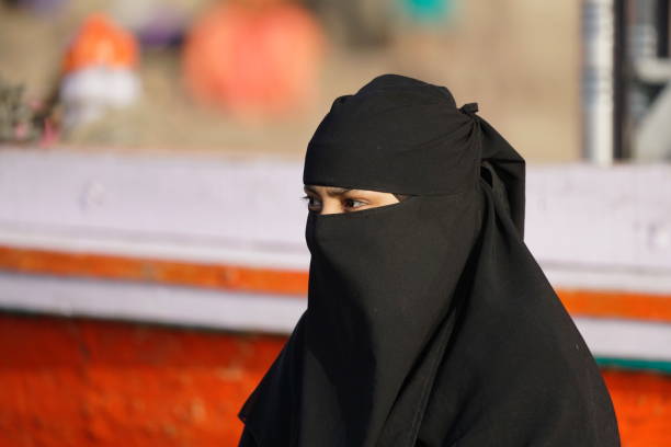 Portrait of an Islam lady in town of Varanasi Varanasi, Uttar Pradesh, India - 24 March 2019: Portrait of an Islam lady. hijab stock pictures, royalty-free photos & images