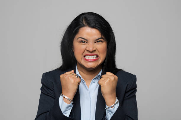 Portrait of angry young businesswoman stock photo